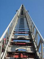 a tall metal tower with a blue sky in the background photo