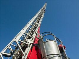 a tall metal tower with a blue sky in the background photo