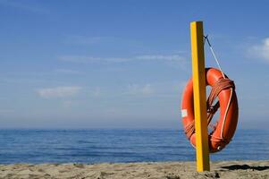 two life preservers on a beach photo