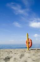 two life preservers on a beach photo