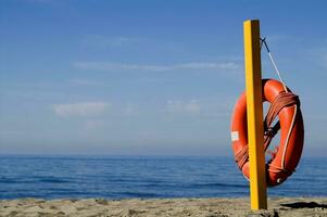 two life preservers on a beach photo