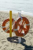 two life preservers on a beach photo