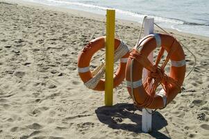 two life preservers on a beach photo