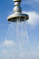 a water pipe with a drop of water on it photo