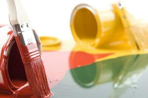 a red, yellow and white liquid is being poured photo