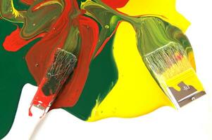 a red, yellow and white liquid is being poured photo