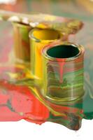 a close up of two tubes with paint on them photo
