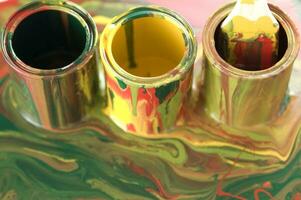 a close up of two tubes with paint on them photo