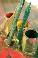a close up of two tubes with paint on them photo