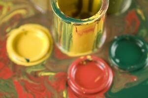 a close up of two tubes with paint on them photo