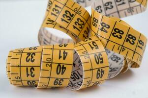 a close up of a measuring tape with numbers photo