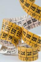 a close up of a measuring tape with numbers photo