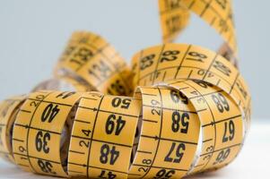 a close up of a measuring tape with numbers photo