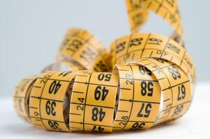 a close up of a measuring tape with numbers photo