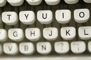 a close up of a typewriter keyboard with the letters oop photo