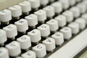 a close up of a typewriter keyboard with the letters oop photo