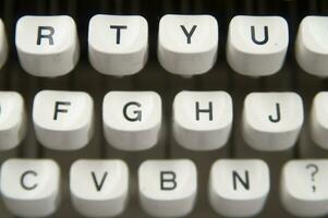 a close up of a typewriter keyboard with the letters oop photo