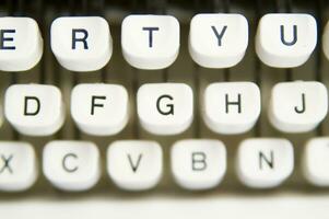 a close up of a typewriter keyboard with the letters oop photo