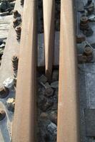 a close up of a railroad track with gravel photo