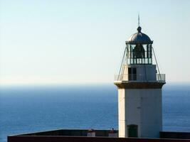 a white and red lighthouse photo