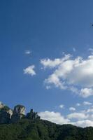 a mountain range with a few houses on top photo