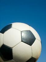 a close up of a soccer ball with leather photo