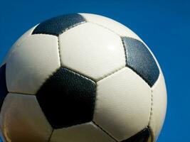 a close up of a soccer ball with leather photo