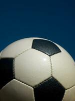 a close up of a soccer ball with leather photo