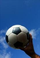 a close up of a soccer ball with leather photo