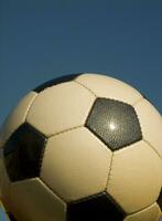 a close up of a soccer ball with leather photo