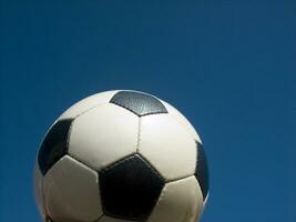 a close up of a soccer ball with leather photo