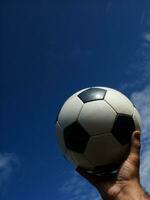 a close up of a soccer ball with leather photo