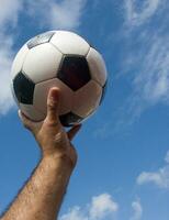 a close up of a soccer ball with leather photo