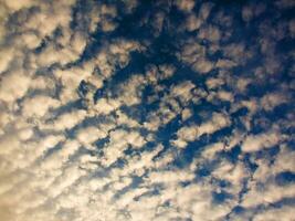 a view of the sky with clouds and sun photo