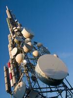 a tower with many different types of antennas photo