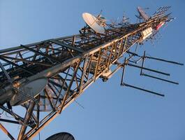 a tower with many different types of antennas photo