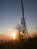 a tower with many different types of antennas photo