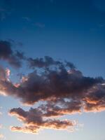 a jet plane flying through a cloudy sky photo