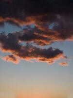 a jet plane flying through a cloudy sky photo