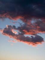 a jet plane flying through a cloudy sky photo