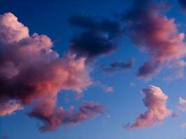 a jet plane flying through a cloudy sky photo