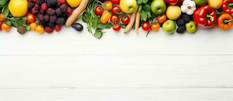 A variety of fruits and vegetables are displayed on a white wooden table background, ideal for photo
