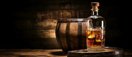 Scotch whiskey bottle, glass, and old wooden barrel with empty space photo