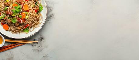 a dish featuring turkey meat, soba noodles, corn, green peas, green beans, and carrots, served photo