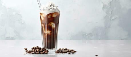 iced cocoa in a clear glass on a marble surface with space for your text photo