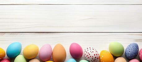 A vibrant Easter banner with a dual Easter egg border on the sides, placed on a white wood background. photo