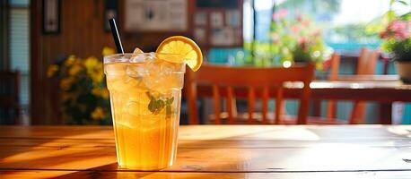 A delectable, refreshing lemonade is placed on a wooden table in a charming local cafe. The addition photo