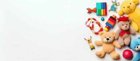 collection of baby and kids toys displayed on a white background. The view is from the top, and photo