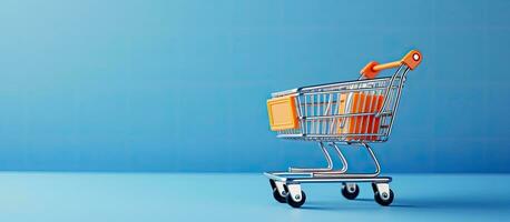 toy shopping cart with boxes on a blue background. There is space available for text or design. photo
