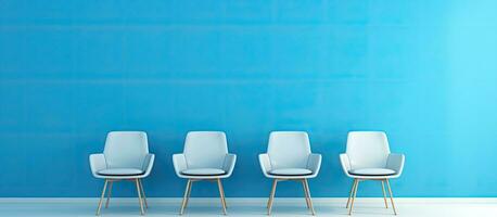 The interior of an empty blue room with modern blue and white chairs offers a minimal space for photo